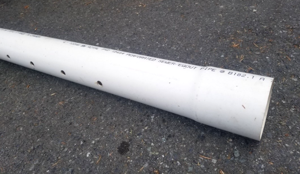 "Photo of a white perforated PVC pipe"