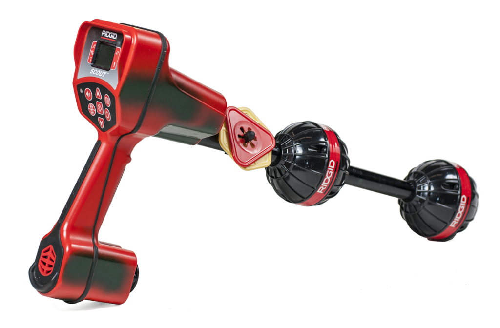 "Image of a digital pipe locator device used with a video inspection system, featuring a handheld design and display screen."